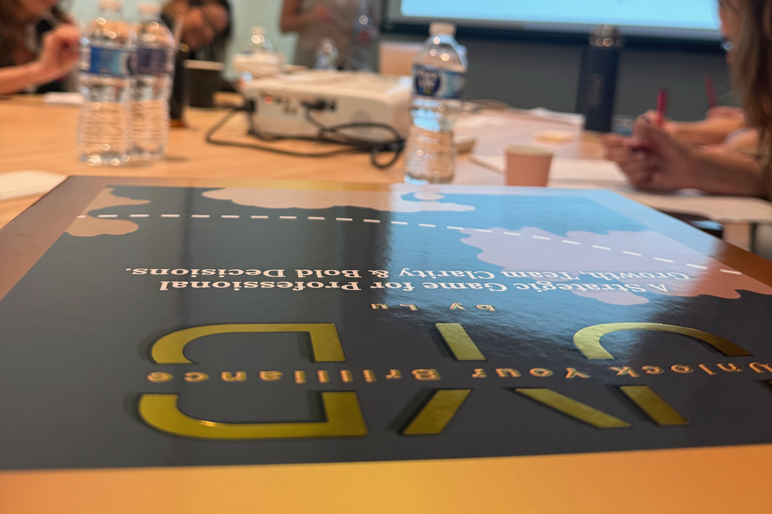 Team gathering around a board game to build connection and strategy at work.